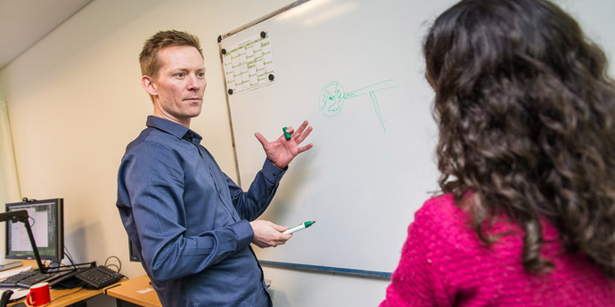 CFIN researchers at whiteboard